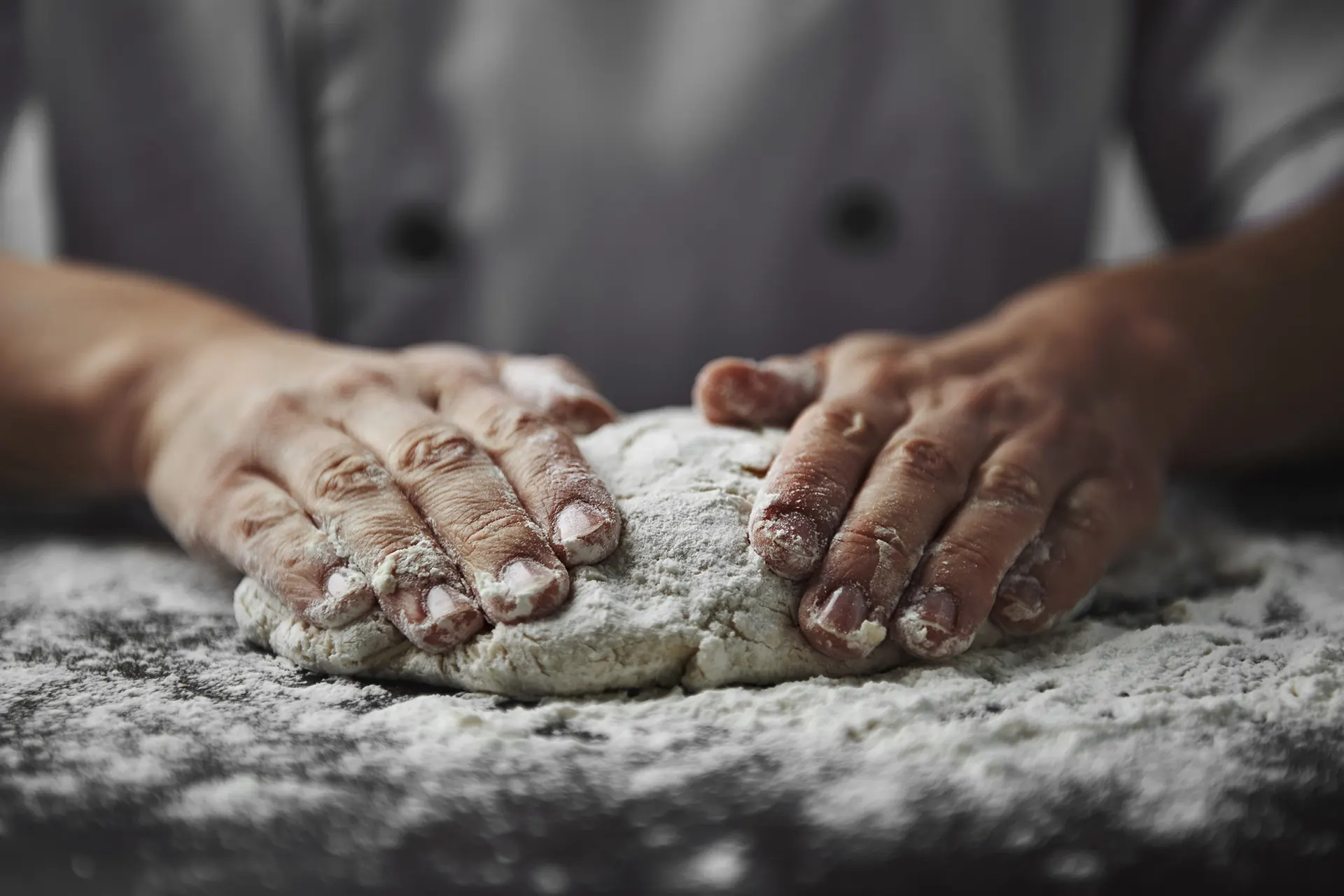 Baker kneading dough