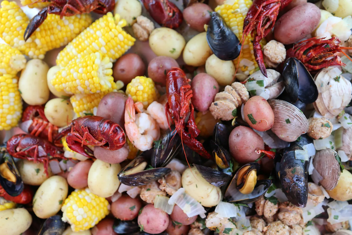 Seafood boil with corn, potatoes, mussels and crayfish